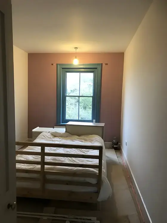 Finished bedroom with rose pink end wall, teal window frame and Skimming Stone side walls, Cambridge