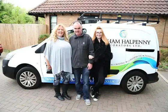 Members of the Graham Halpenny team beside the company's branded van