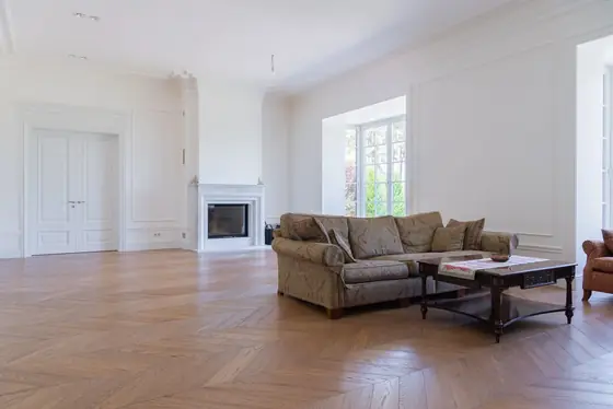 Period sitting room with a sanded and oiled herringbone oak floor