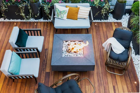 Garden seating on stained timber decking, seen from above